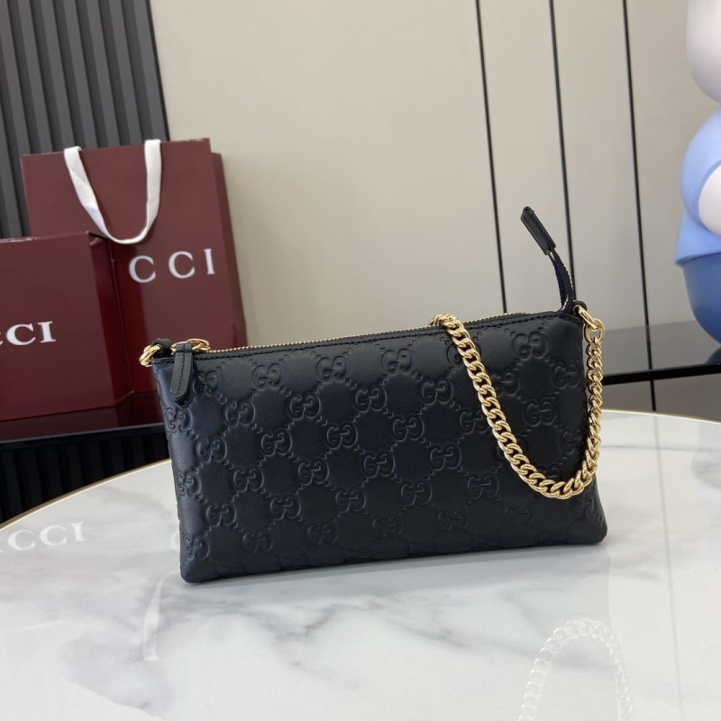 G*u*i clutch bags